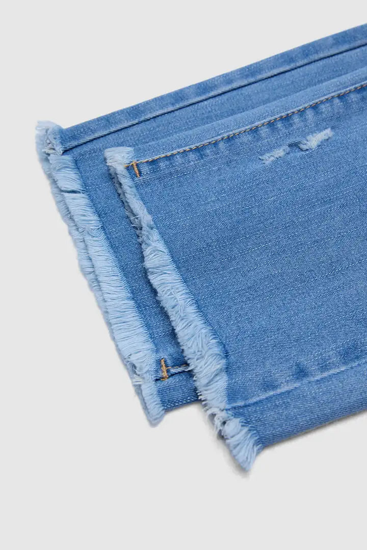 Zora - Cropped broek met rafelige zoom en scheurtjes