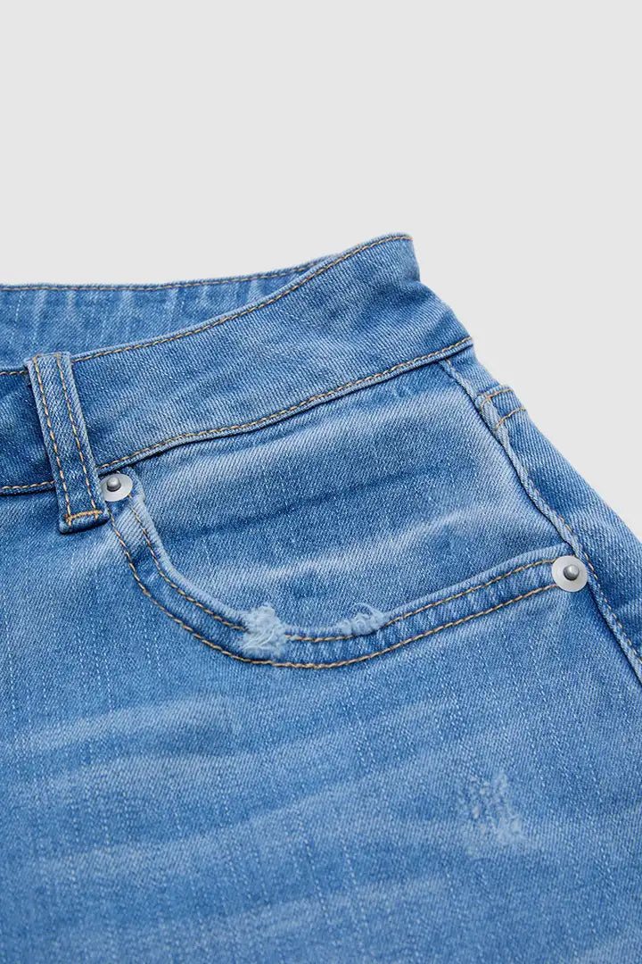 Zora - Cropped broek met rafelige zoom en scheurtjes